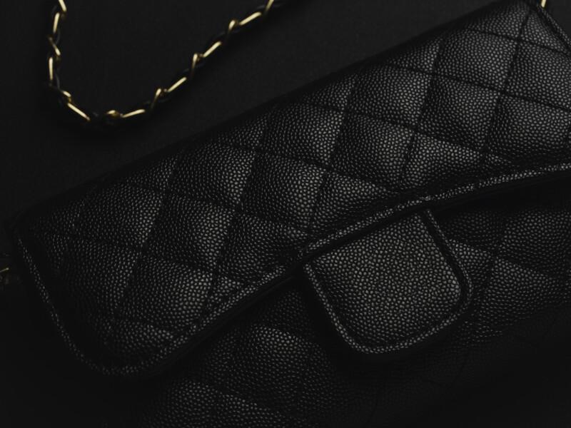 black leather bag with golden chain