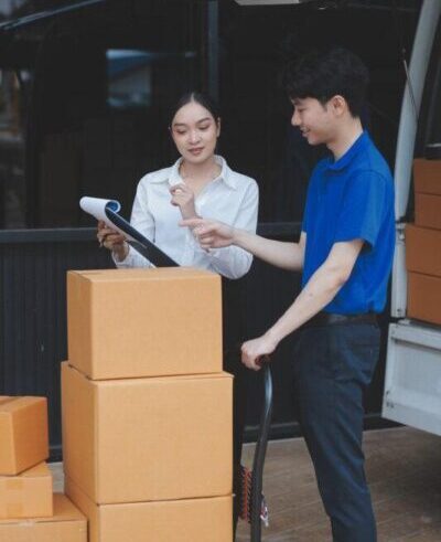 truck mover unloading van carrying boxes moving house rotated e1759802277694